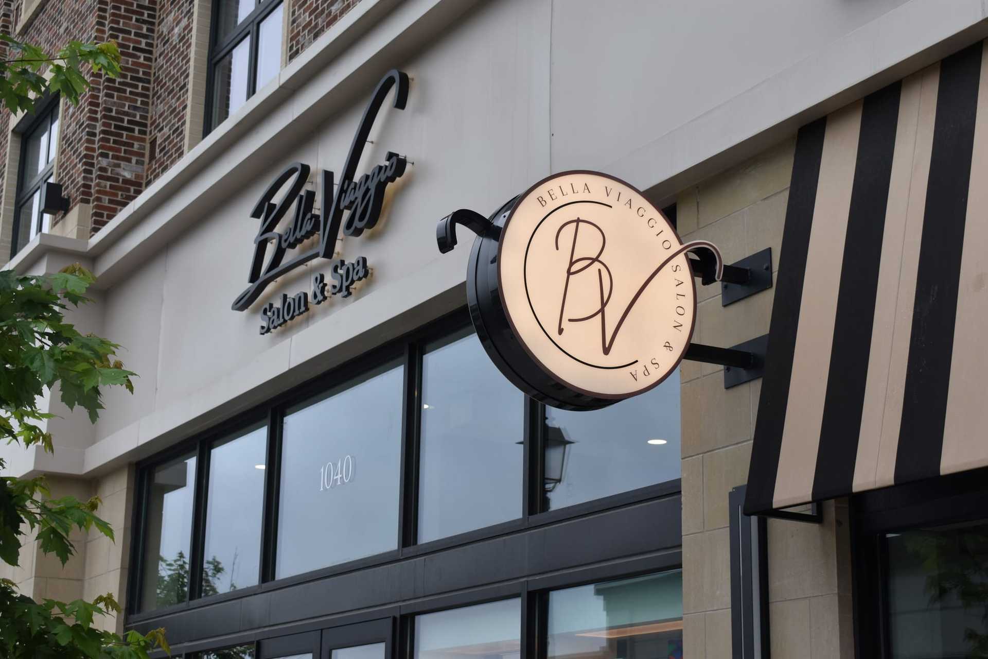 Exterior of Bella Viaggio Salon & Spa with signage and storefront window.